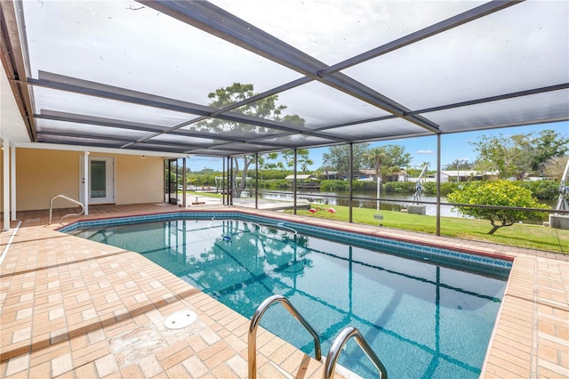 swimming pool featuring a water view, a patio area, a lanai, and a yard