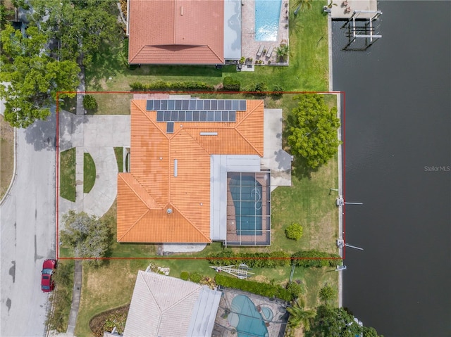 aerial view of property and surrounding area with property boundaries highlighted and a pool area