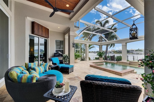 view of patio featuring ceiling fan, an outdoor living space, a hot tub, a water view, and glass enclosure