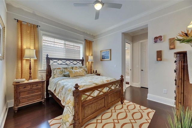 bedroom with dark wood-style floors, baseboards, crown molding, ceiling fan, and ensuite bathroom