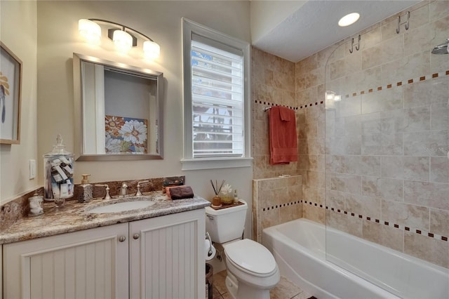 full bath with toilet, vanity, and shower / tub combination