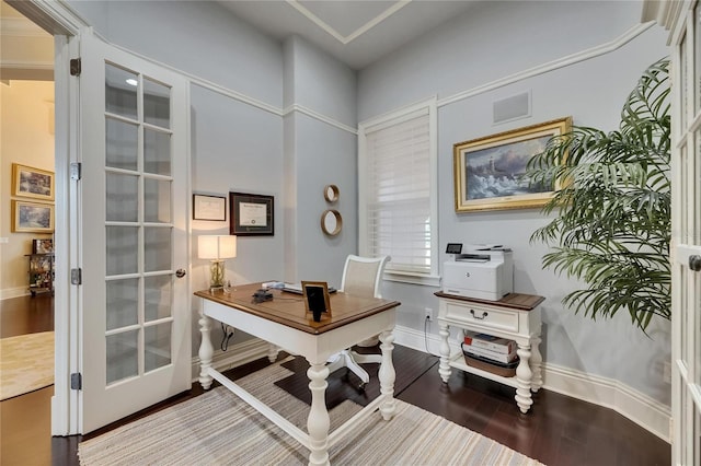 office space featuring baseboards and wood finished floors