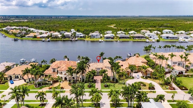 aerial view of residential area featuring a nearby body of water