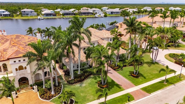 aerial view of residential area with a nearby body of water