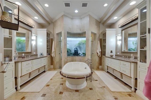 full bathroom with ornamental molding, a soaking tub, two vanities, recessed lighting, and walk in shower