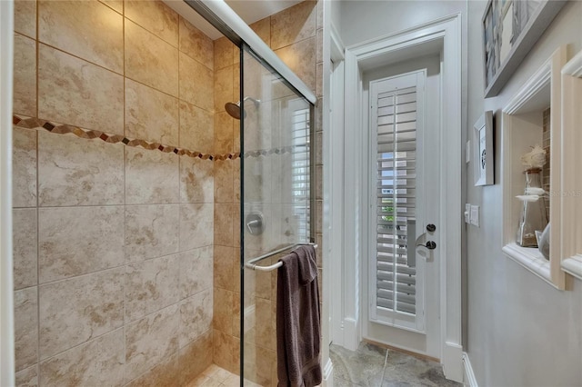 bathroom featuring a shower stall