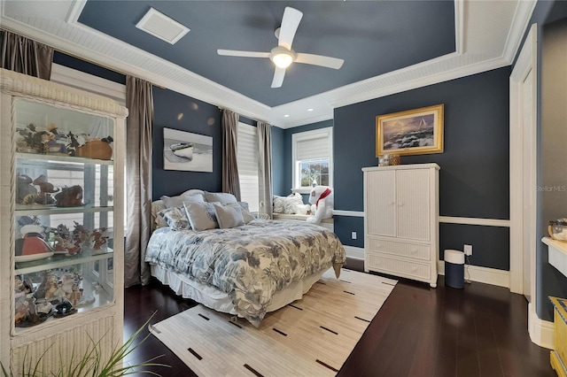bedroom with ornamental molding, baseboards, wood finished floors, and ceiling fan
