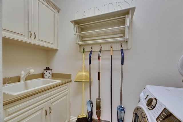 laundry room featuring cabinet space and washer and dryer