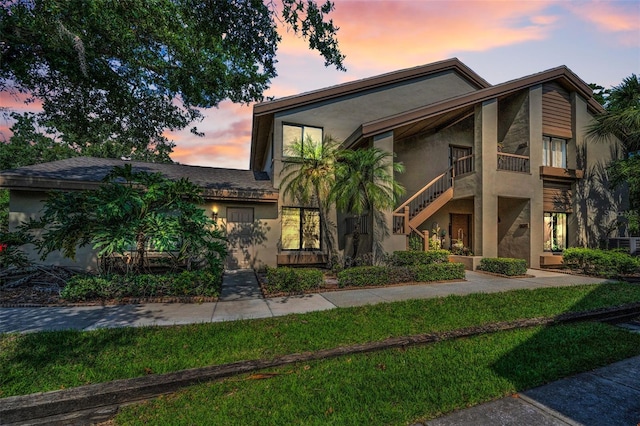 3079 Landmark Blvd Unit 1608, Palm Harbor, FL 34684 - view of front of home with stucco siding and stairway