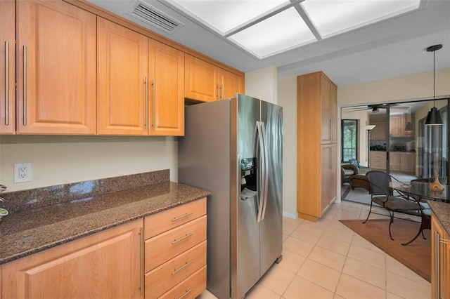 3079 Landmark Blvd Unit 1608, Palm Harbor, FL 34684 - kitchen featuring stainless steel fridge, light tile patterned flooring, ceiling fan, and dark stone counters