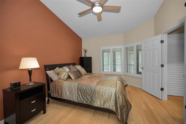 3079 Landmark Blvd Unit 1608, Palm Harbor, FL 34684 - bedroom with vaulted ceiling, light wood-style floors, ceiling fan, and baseboards