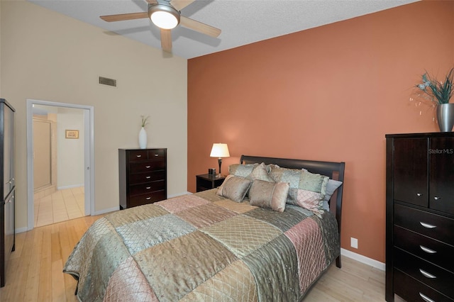 3079 Landmark Blvd Unit 1608, Palm Harbor, FL 34684 - bedroom with light wood-type flooring, baseboards, and ceiling fan
