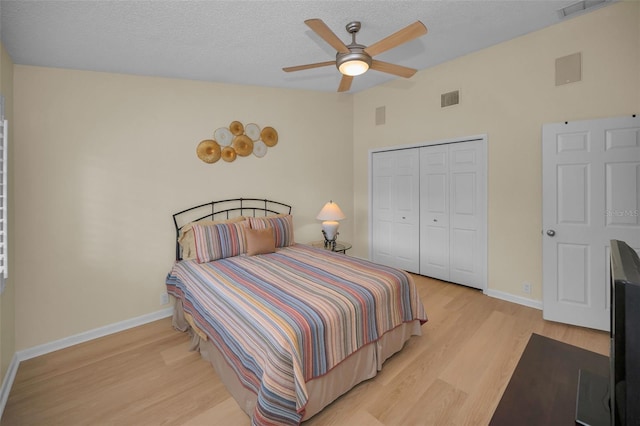 3079 Landmark Blvd Unit 1608, Palm Harbor, FL 34684 - bedroom with lofted ceiling, light wood finished floors, a closet, baseboards, and a ceiling fan