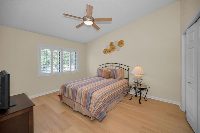 3079 Landmark Blvd Unit 1608, Palm Harbor, FL 34684 - bedroom with light wood-style floors, baseboards, a closet, and a ceiling fan