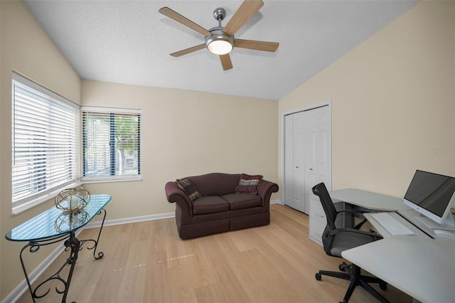 3079 Landmark Blvd Unit 1608, Palm Harbor, FL 34684 - office space featuring wood finished floors, a ceiling fan, vaulted ceiling, a textured ceiling, and baseboards