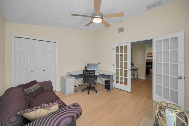 3079 Landmark Blvd Unit 1608, Palm Harbor, FL 34684 - office space featuring french doors, ceiling fan, light wood-style floors, a textured ceiling, and baseboards