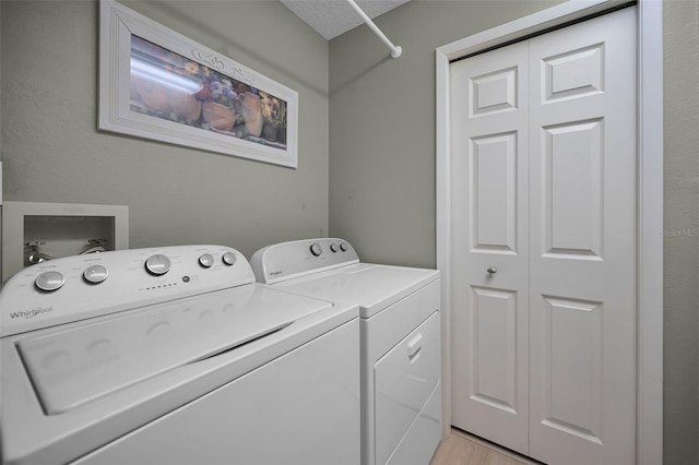 3079 Landmark Blvd Unit 1608, Palm Harbor, FL 34684 - washroom featuring independent washer and dryer and light wood-style floors