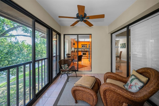 3079 Landmark Blvd Unit 1608, Palm Harbor, FL 34684 - sunroom featuring tile patterned flooring and ceiling fan