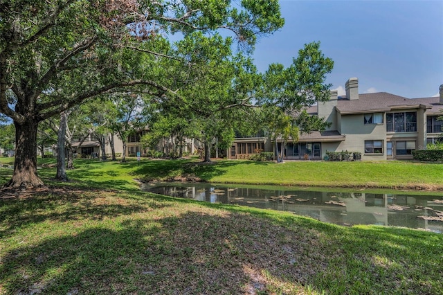 3079 Landmark Blvd Unit 1608, Palm Harbor, FL 34684 - view of green lawn featuring a water view