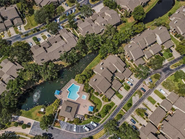 3079 Landmark Blvd Unit 1608, Palm Harbor, FL 34684 - aerial view of property and surrounding area featuring nearby suburban area, a pool, and a large body of water