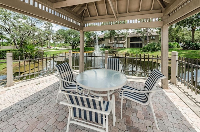 3079 Landmark Blvd Unit 1608, Palm Harbor, FL 34684 - view of patio featuring a gazebo, a water view, and outdoor dining area