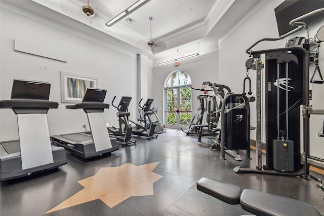 workout area featuring crown molding