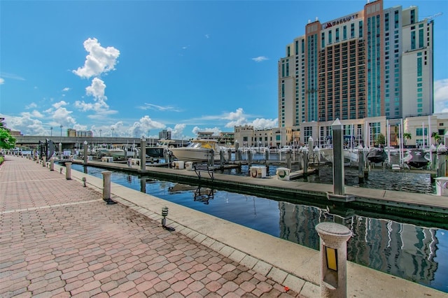 dock area with a water view and boat lift