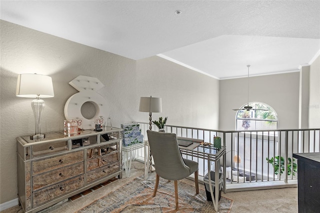 home office featuring carpet floors, crown molding, and a textured wall