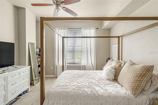 bedroom featuring light colored carpet and ceiling fan