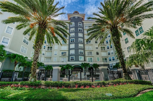 view of building exterior featuring fence