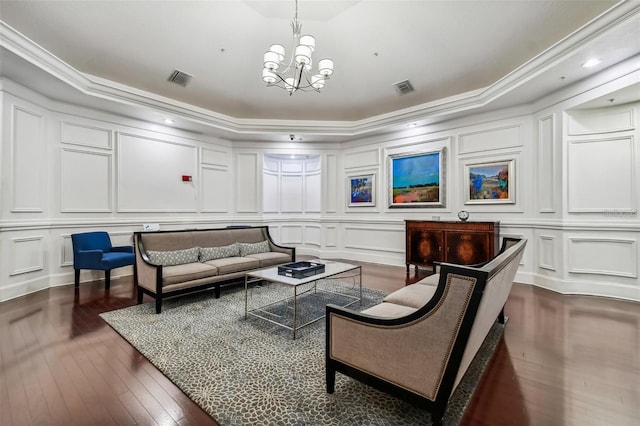 common area featuring a decorative wall, ornamental molding, and recessed lighting
