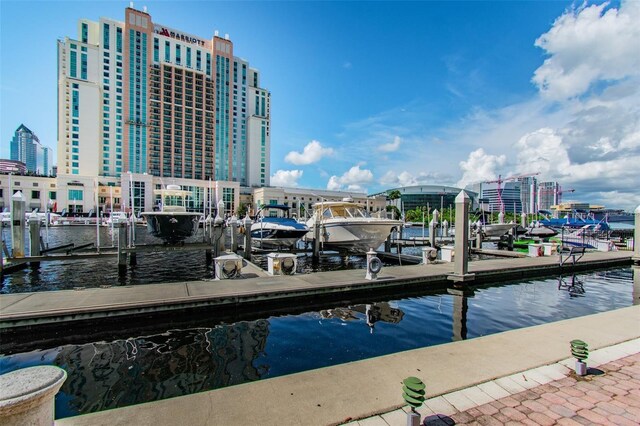 dock area with a water view and a city view