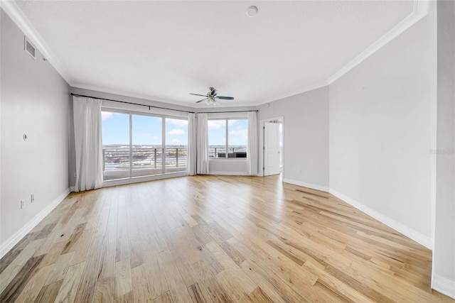 unfurnished room with light wood finished floors, baseboards, a ceiling fan, and ornamental molding