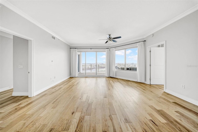 unfurnished living room with crown molding, visible vents, baseboards, ceiling fan, and light wood-style floors