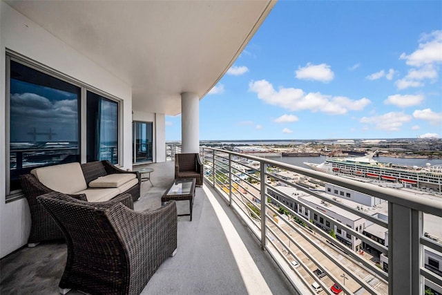balcony featuring a water view