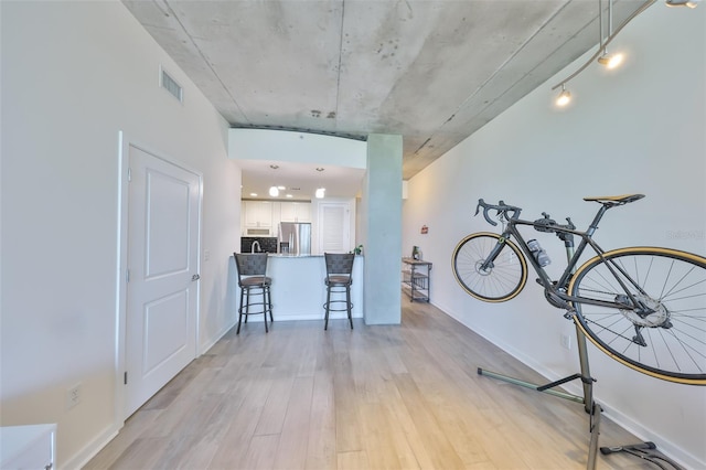 interior space featuring light wood-style flooring and visible vents