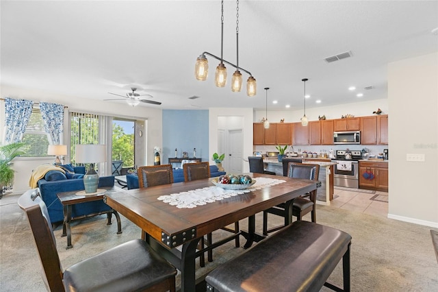 10626 Laguna Plains Dr, Riverview, FL 33578 - dining area with a ceiling fan, light colored carpet, recessed lighting, and baseboards