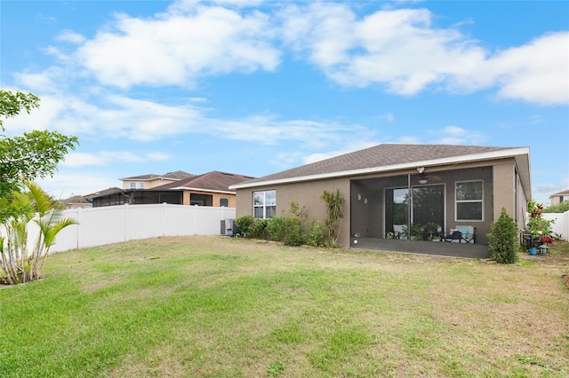 10626 Laguna Plains Dr, Riverview, FL 33578 - rear view of house with stucco siding, central AC unit, and a sunroom