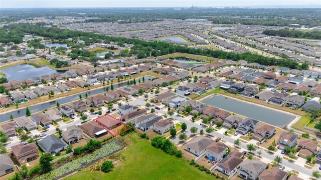 10626 Laguna Plains Dr, Riverview, FL 33578 - aerial perspective of suburban area with property parcel outlined and a nearby body of water