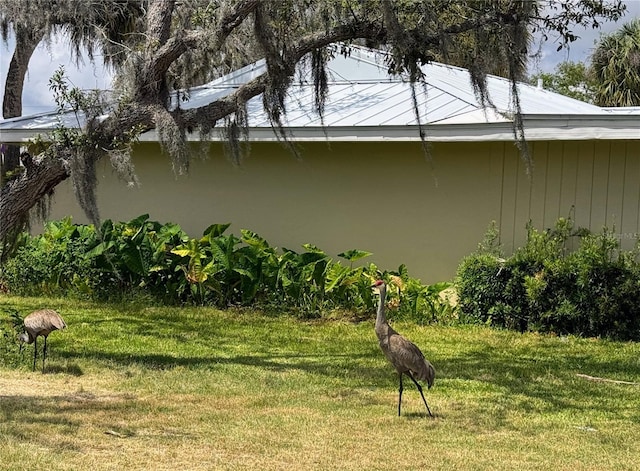 11473 W Sandpiper Ct, Crystal River, FL 34429 - view of property exterior with a lawn