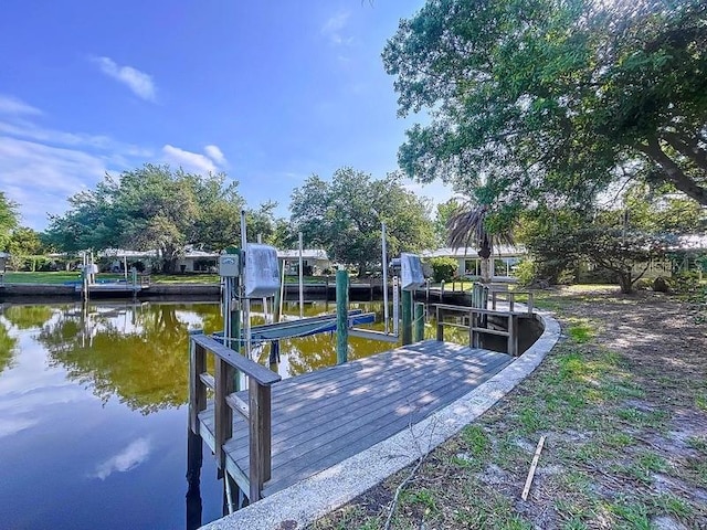 11473 W Sandpiper Ct, Crystal River, FL 34429 - dock area featuring boat lift and a water view