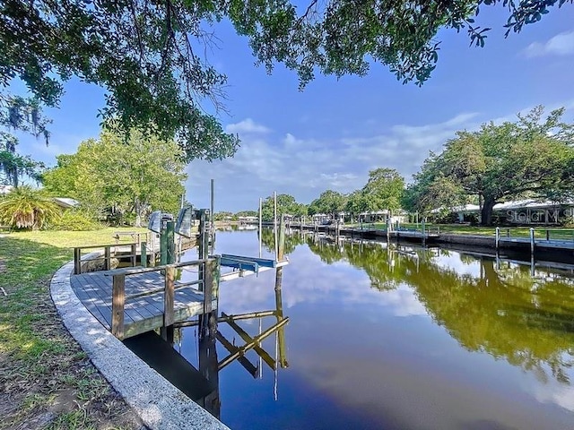 11473 W Sandpiper Ct, Crystal River, FL 34429 - dock featuring boat lift and a water view