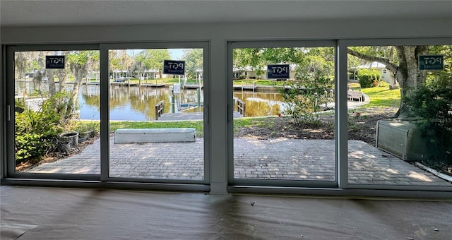 11473 W Sandpiper Ct, Crystal River, FL 34429 - doorway to outside with a water view