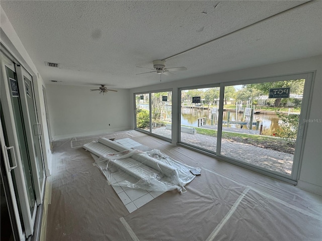 11473 W Sandpiper Ct, Crystal River, FL 34429 - unfurnished sunroom featuring a water view and ceiling fan