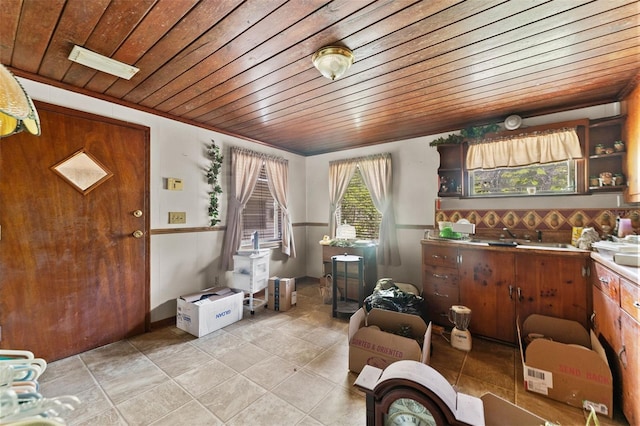interior space featuring light tile patterned floors, visible vents, and wooden ceiling