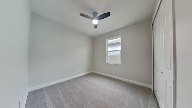 20092 Stone Pine Cir, Lutz, FL 33558 - unfurnished bedroom with carpet, baseboards, a closet, and ceiling fan