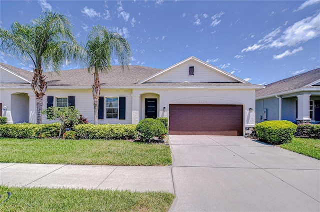 5732 Stockport St, Riverview, FL 33578 - single story home featuring concrete driveway, stucco siding, a garage, and a front lawn