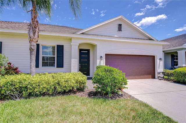 5732 Stockport St, Riverview, FL 33578 - ranch-style home featuring concrete driveway, a garage, and stucco siding