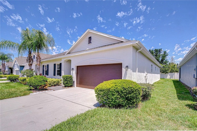 5732 Stockport St, Riverview, FL 33578 - single story home with fence, an attached garage, stucco siding, concrete driveway, and a front lawn