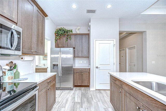 5732 Stockport St, Riverview, FL 33578 - kitchen featuring light countertops, appliances with stainless steel finishes, visible vents, and recessed lighting